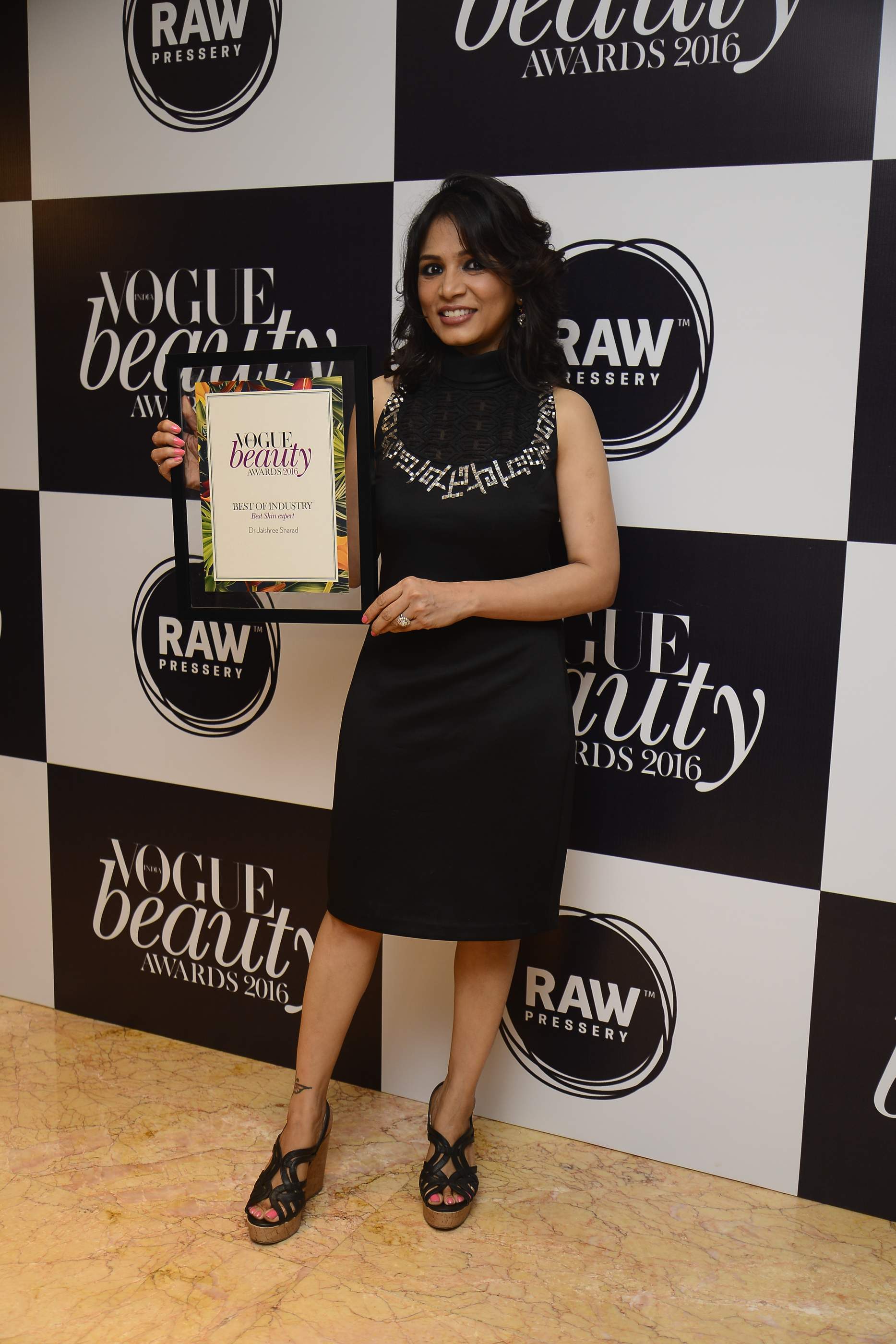 Dr. Jaishree Receiving The Best Skincare Expert Title at the Vogue Beauty Awards in 2016.